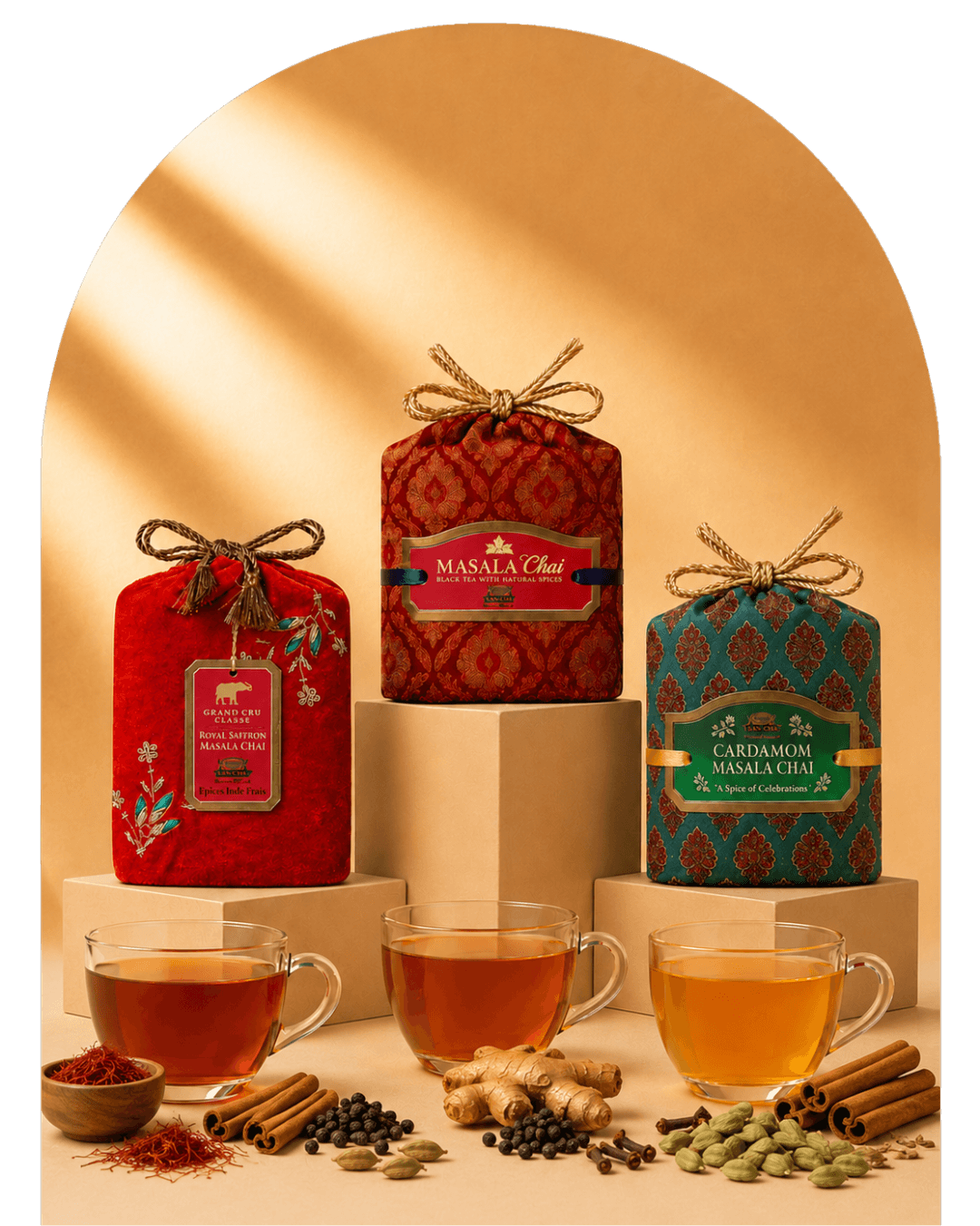 Three packaged tea products displayed on pedestals with glass cups of brewed tea and spices arranged in front, set against a warm beige background with a soft arch shadow.