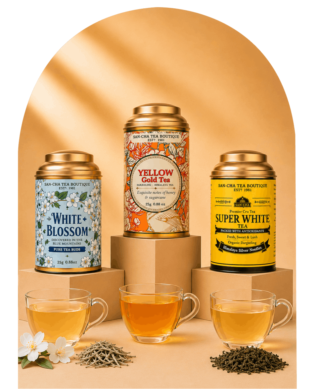 Three San Ola Tea Boutique tea tins displayed on pedestals with three glass cups of brewed tea and loose tea leaves in front, set against a warm beige arched backdrop with a black side border.