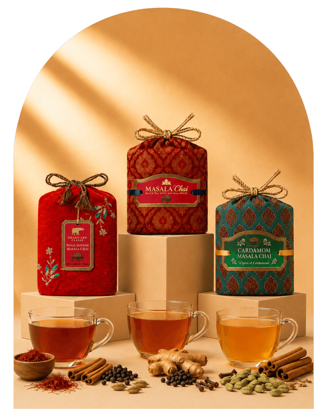 Three packaged tea products displayed on pedestals with glass cups of brewed tea and spices arranged in front, set against a warm beige background with a soft arch shadow.