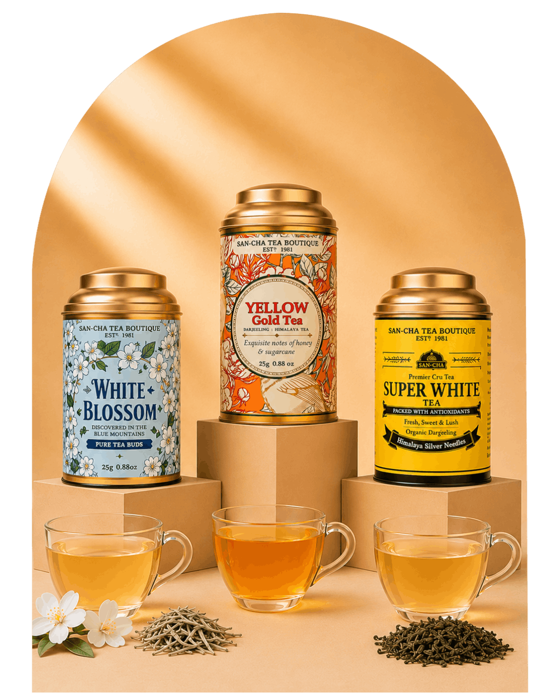 Three San Ola Tea Boutique tea tins displayed on pedestals with three glass cups of brewed tea and loose tea leaves in front, set against a warm beige arched backdrop with a black side border.